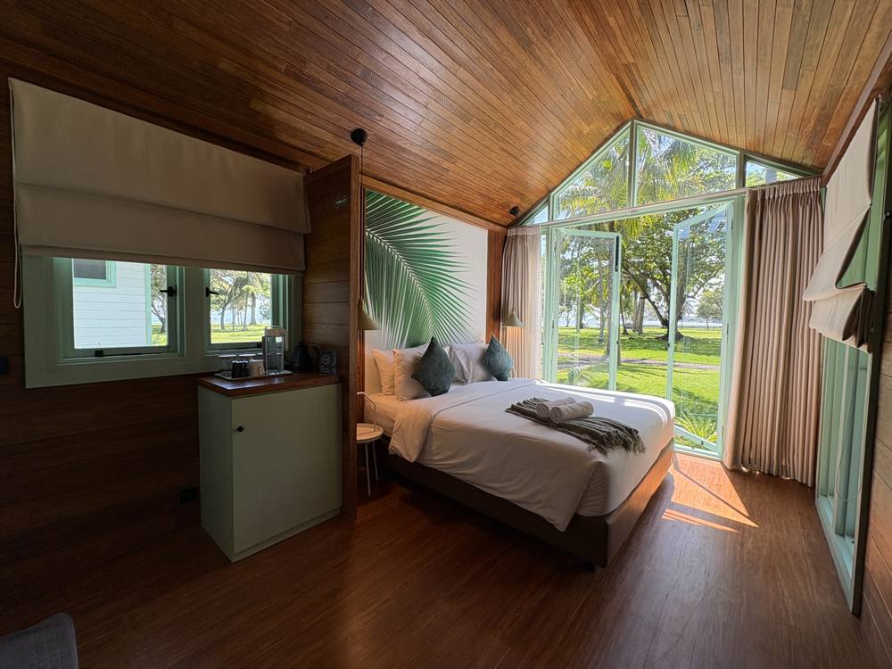 Adem Anyer Park cabin interior with windows overlooking the garden